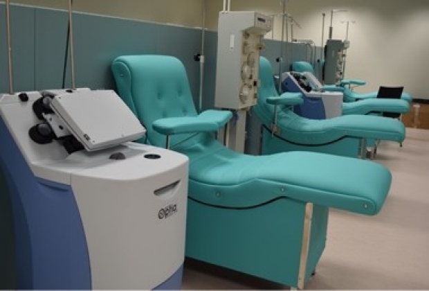 Plasmapheresis equipment in a treatment room at Fundació ACE in Barcelona, the site of a trial of complete plasma exchange and albumin replacement in people with AD. [Courtesy of Fundació ACE.]