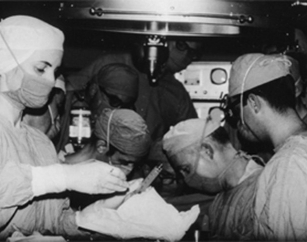 black and white photo of surgeons performing first heart transplant in the US