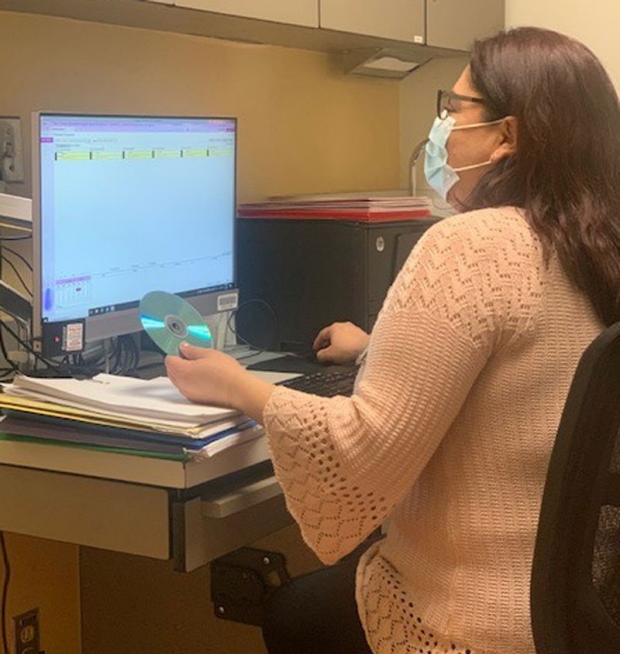 Patient coordinator working at her desk