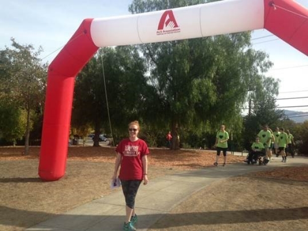 Jennifer Fisher crossing the finish line at the ALS Walk