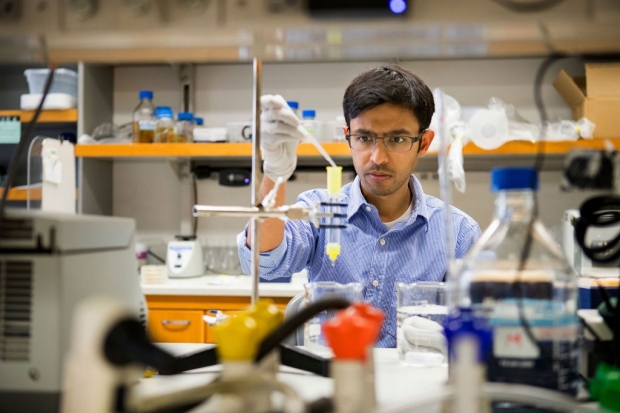 Aashish Manglik working in a chemistry lab