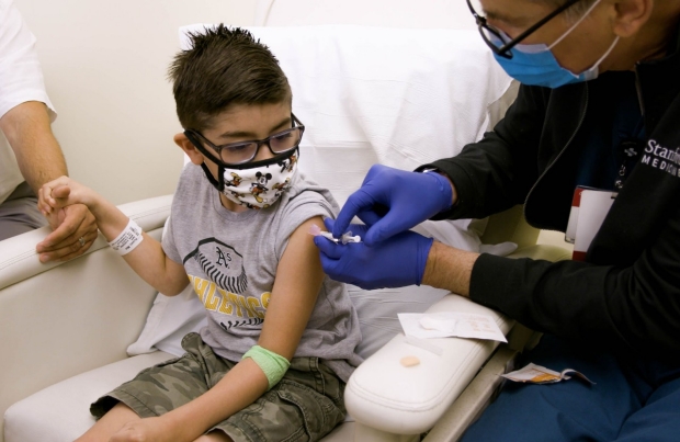Child is being vaccinated at Stanford Health Care