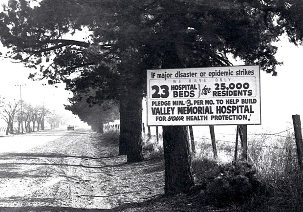A sign encouraging donations for the creation of Valley Memorial Hospital sits on Stanley Boulevard in the 1950s. Courtesy of Stanford Health Care